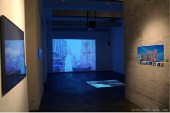 Abstract shadow composition created by overlapping structural forms on a rough surface.