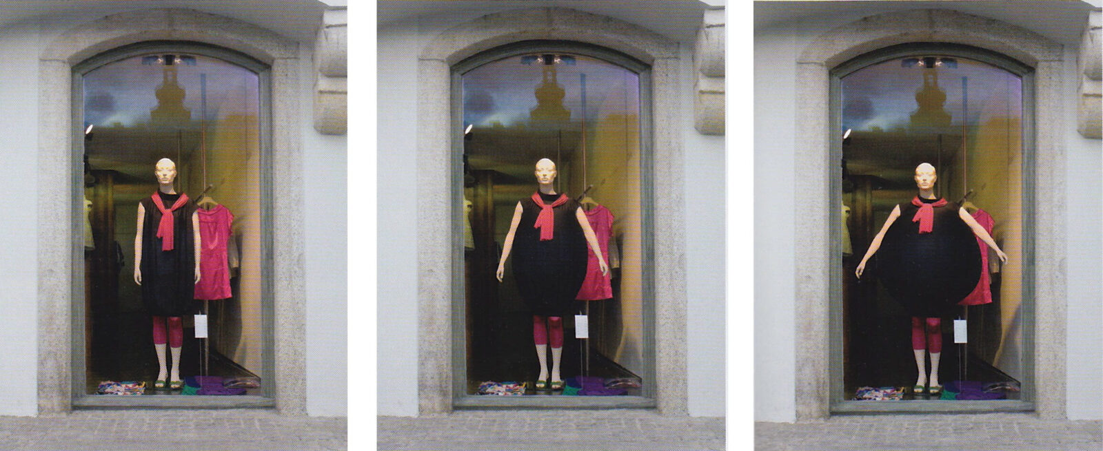Triptych documentation of a storefront installation showing a mannequin wearing an expandable black garment displayed in three stages behind a shop window.