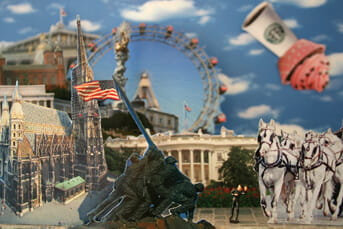 Photomontage collage, composite Washington DC, Vienna, and Linz cityscape with Ferris wheel, neoclassical buildings, White House, and horse-drawn carriage, miniature dancing man figure in foreground, oversized coffee cup and muffin floating in cloudy sky.